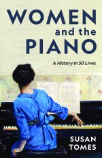 A woman in a blue dress sits at the piano with her back to the viewer.