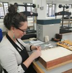 Image of Marina Pelissari working on a book