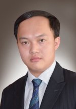 A photograph of Dr Zhao Ding wearing a suit and tie.