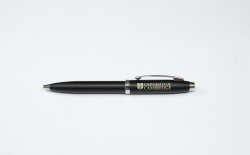 Black pen with University branding in gold