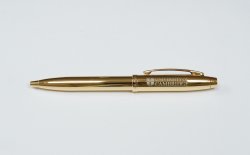 Gold pen with University branding