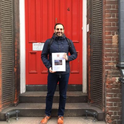 Petros Chatzimpagolou (Magdalene) submitting his thesis outside the red door Petros Chatzimpagolou (Magdalene) submitting his thesis outside the red door