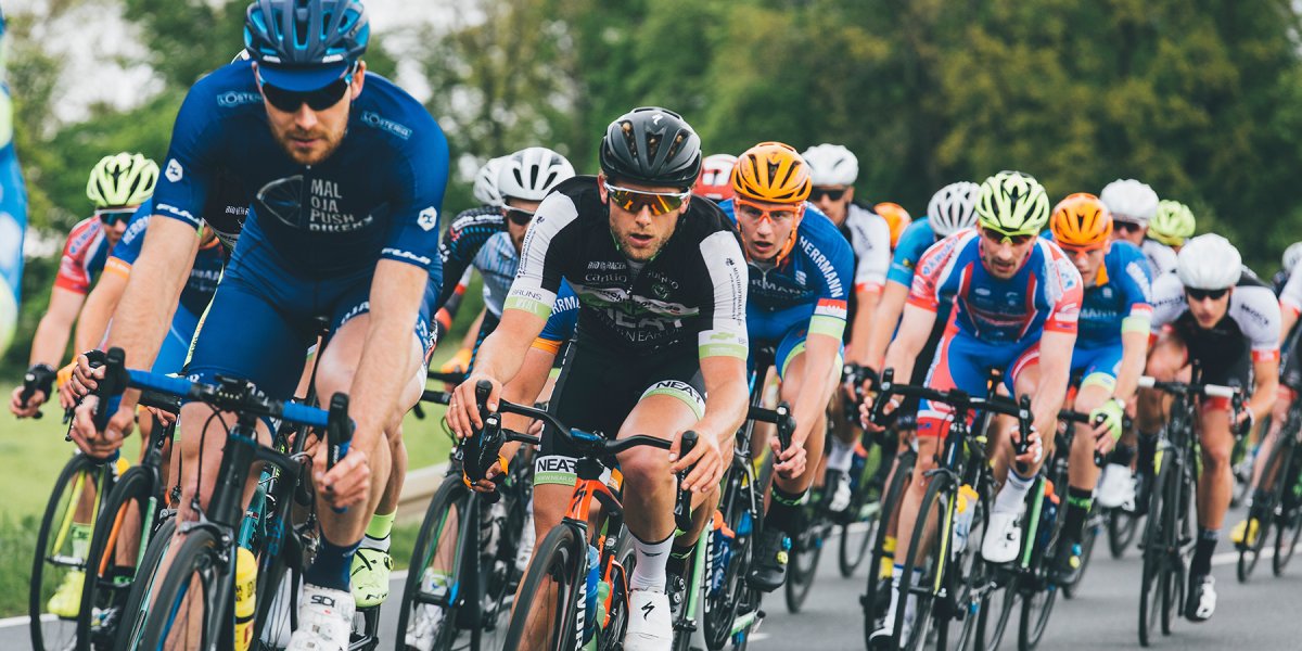 Group of cyclist on asphalt road