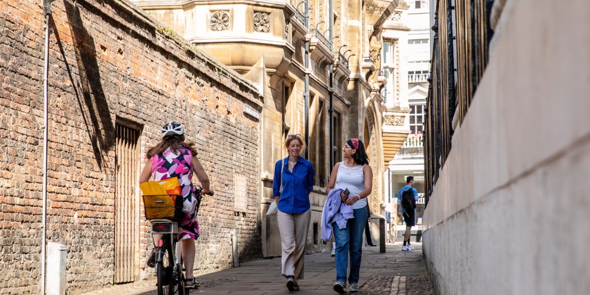 students walking along trinity lane in cambridge