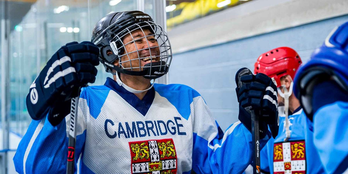 Smilling ice hockey player in Cambridge uniform