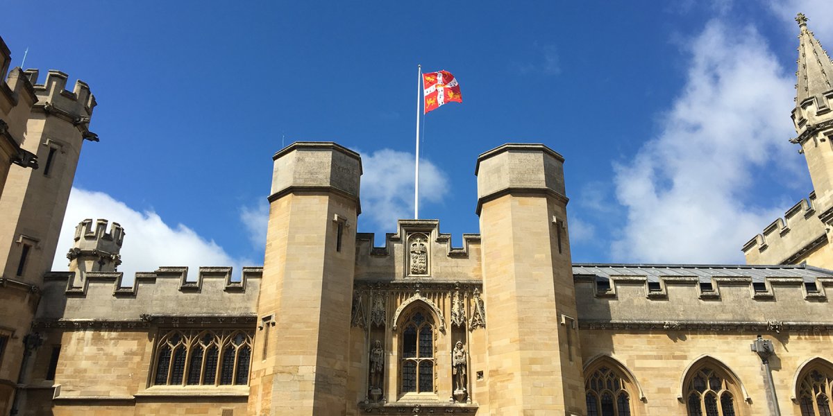 University flag flying above Old Schools