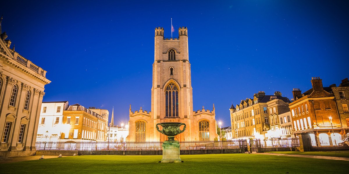 Night looking across Senate House Lawn towards Great St Mary's, the University Church