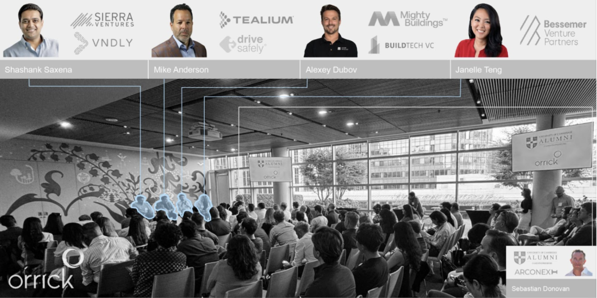 Photograph of the event highlighting the speakers in the crowd