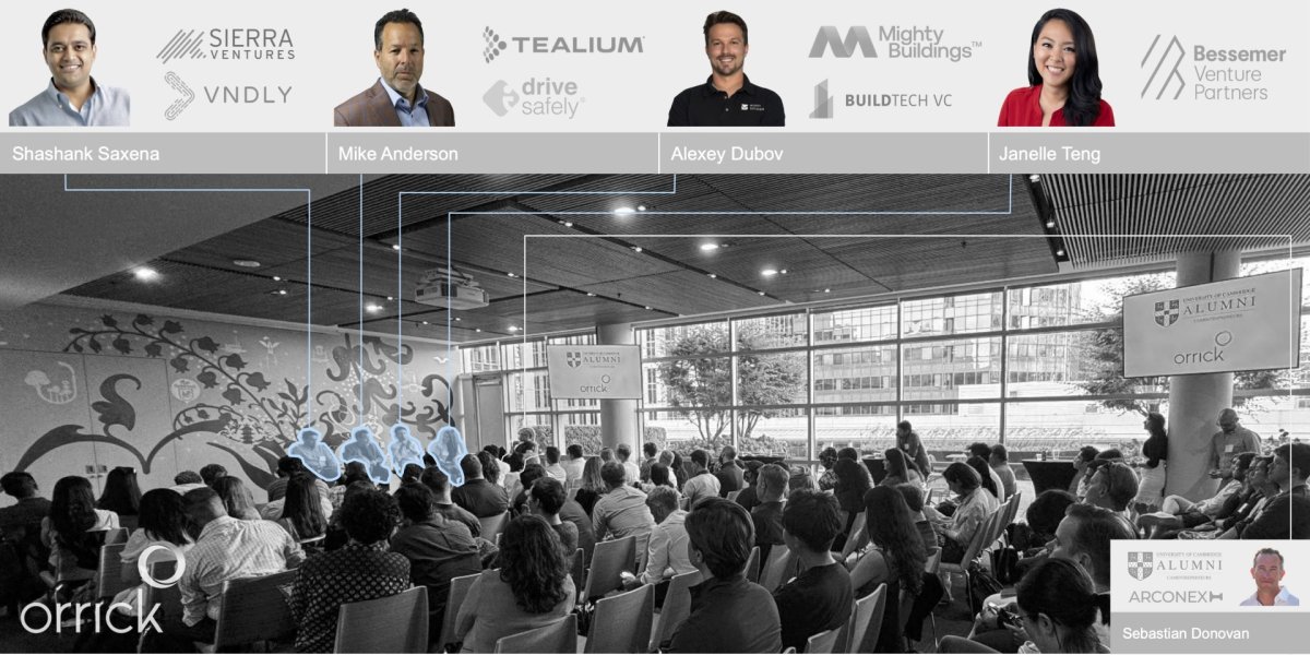 Photograph of the event highlighting the speakers in the crowd