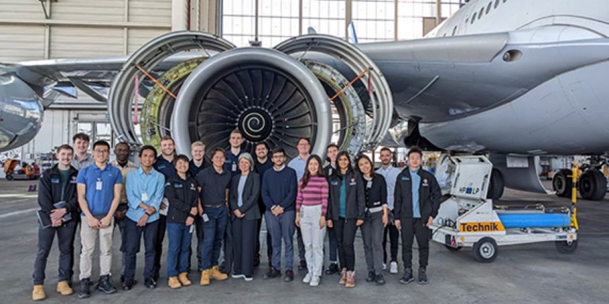 people and a plane engine