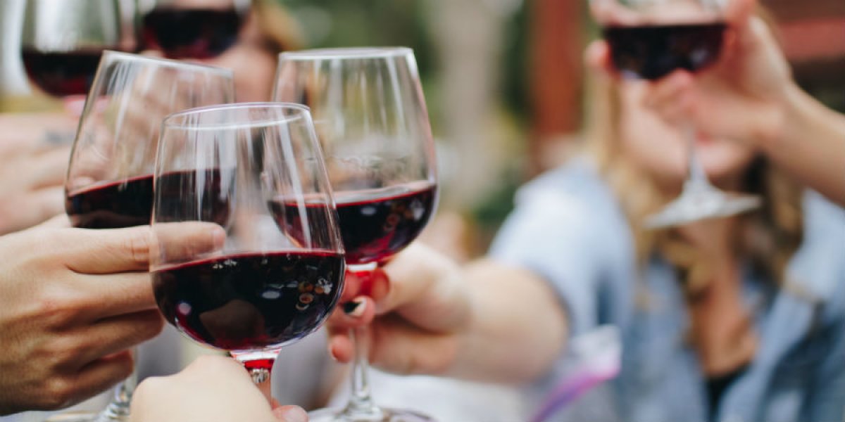 Red wine glasses cheersing