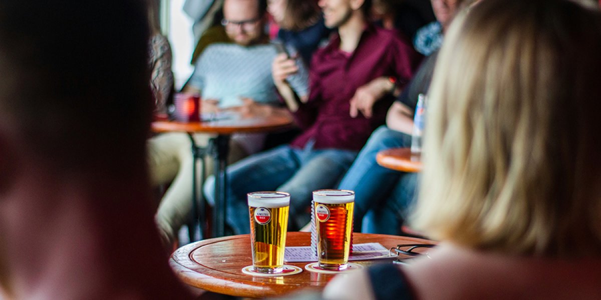 Image of people at a pub quiz