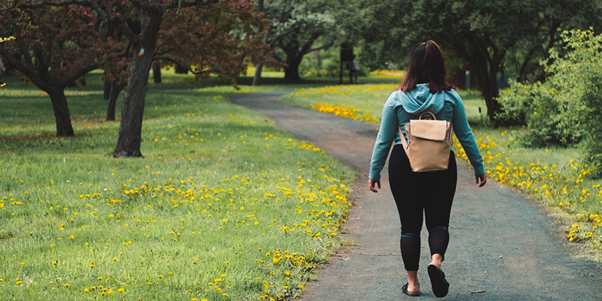 image of someone walking in the park