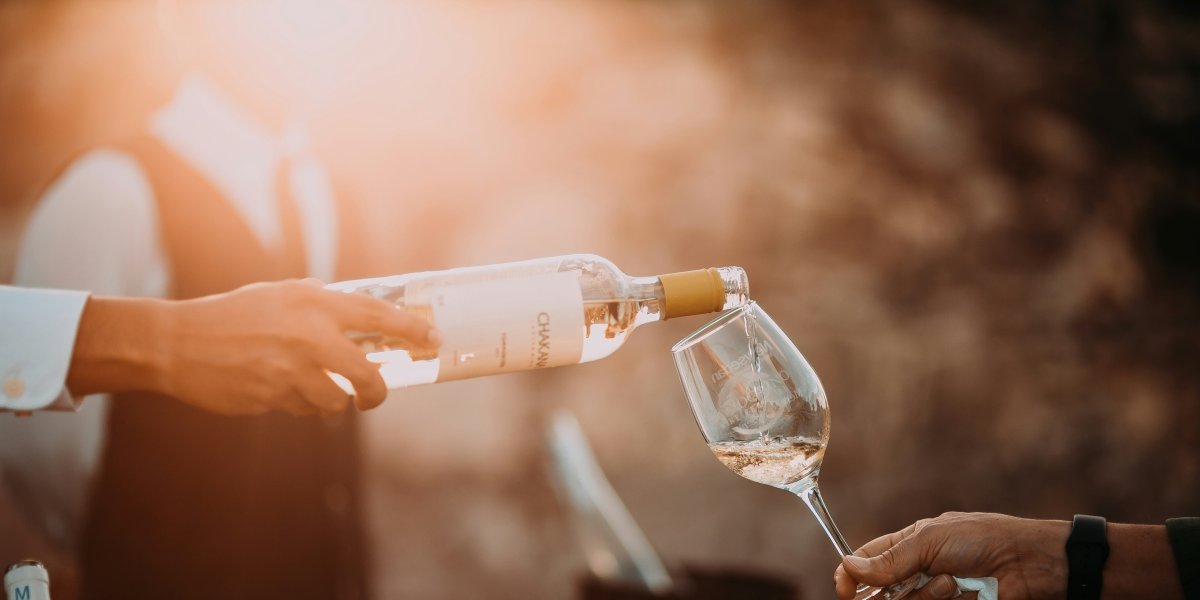 Glass or wine being poured