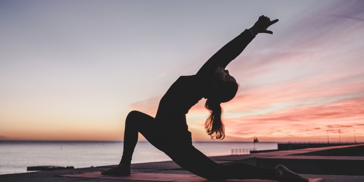 image of someone doing yoga outside