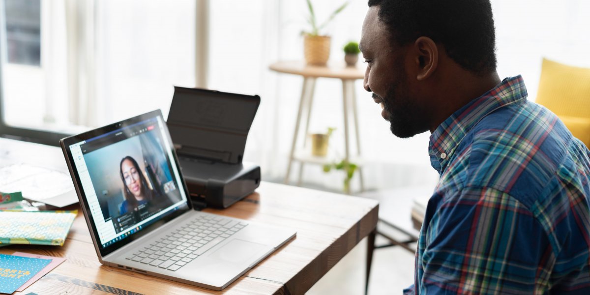 Man at home talking to woman via Zoom