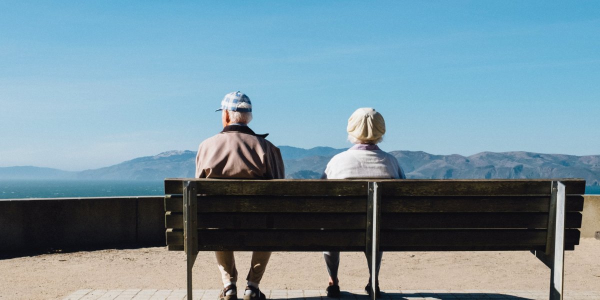 Two elderly people on a bench