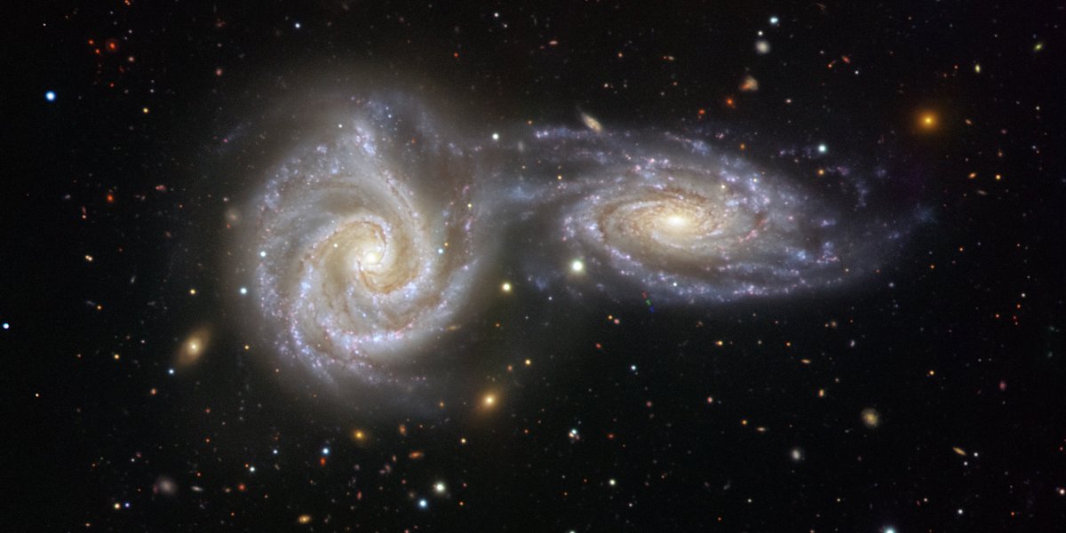 image of two spiral galaxies