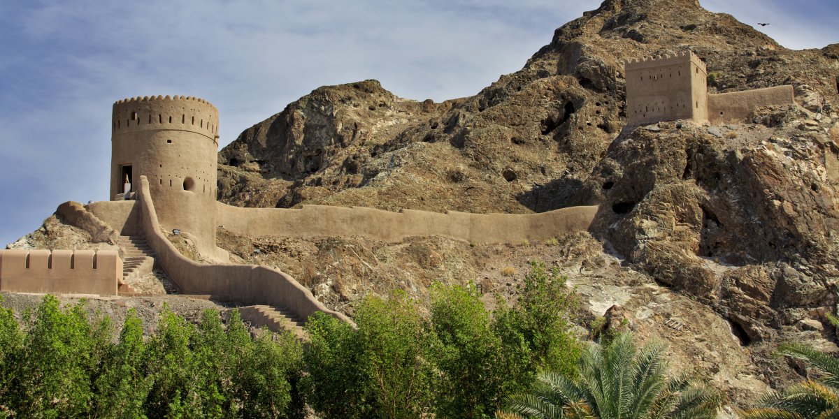 Watchtowers and defending walls and mountains in Old Muscat, Oman