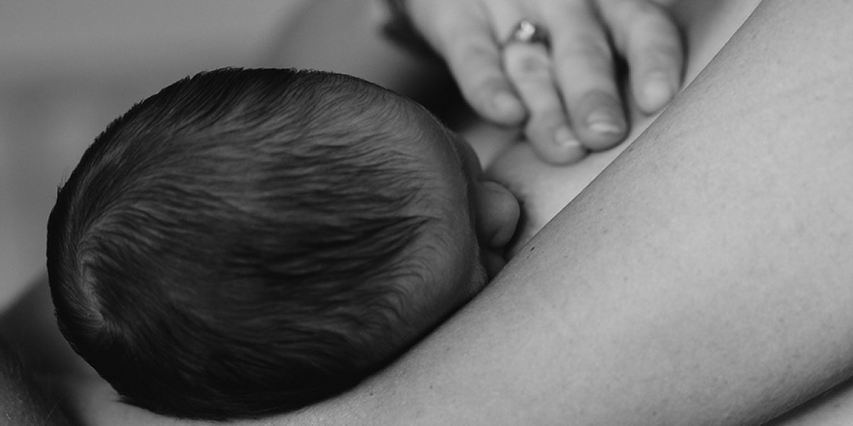 Women breastfeeding a baby
