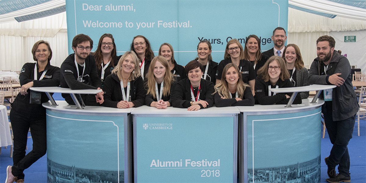 Alumni Festival team behind reception table