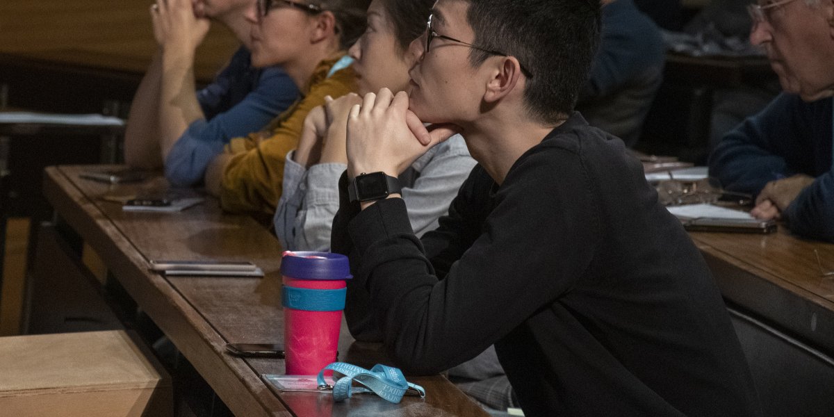 Festival attendees concentrate on speaker