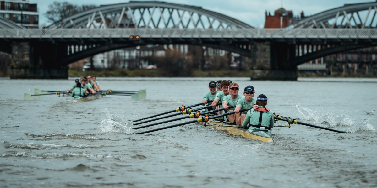 Photograph capturing the Trial 8s rowing on the river thames in december 2024. Image shows two boat crews rowing along the river
