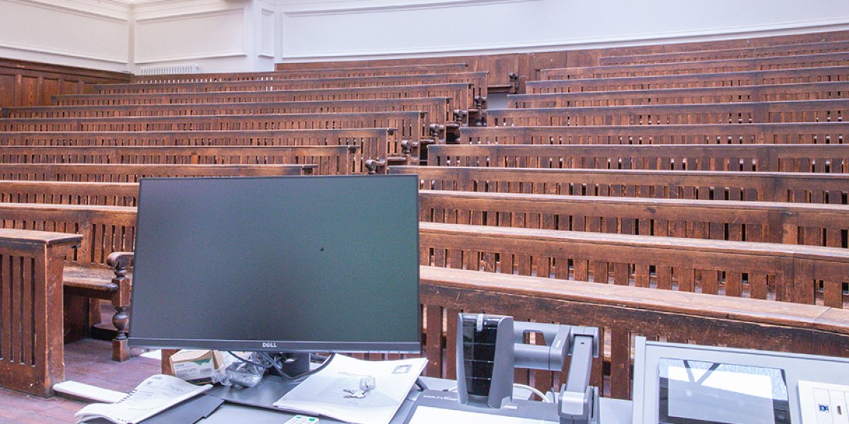 Old wooden seats in the refurbished lecture hall
