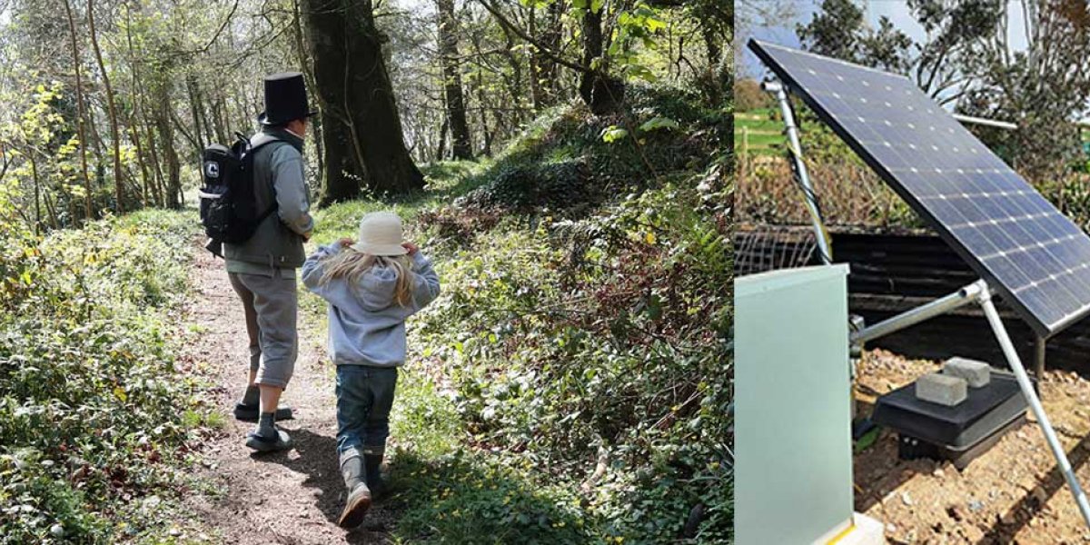 Caroline leads a student through the woods; solar panel connected to the Eden Project's geothermal monitoring station.