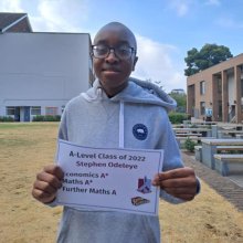 Stephen Odeleye holding his A-level results