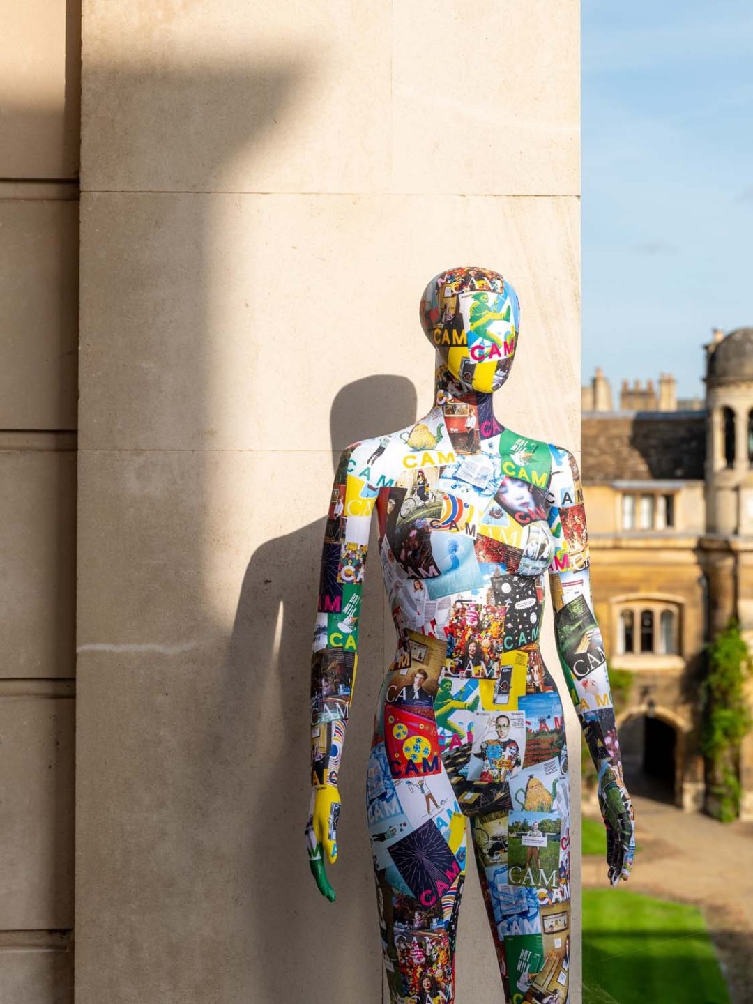 Mannequin covered in CAM magazine covers standing in a college court