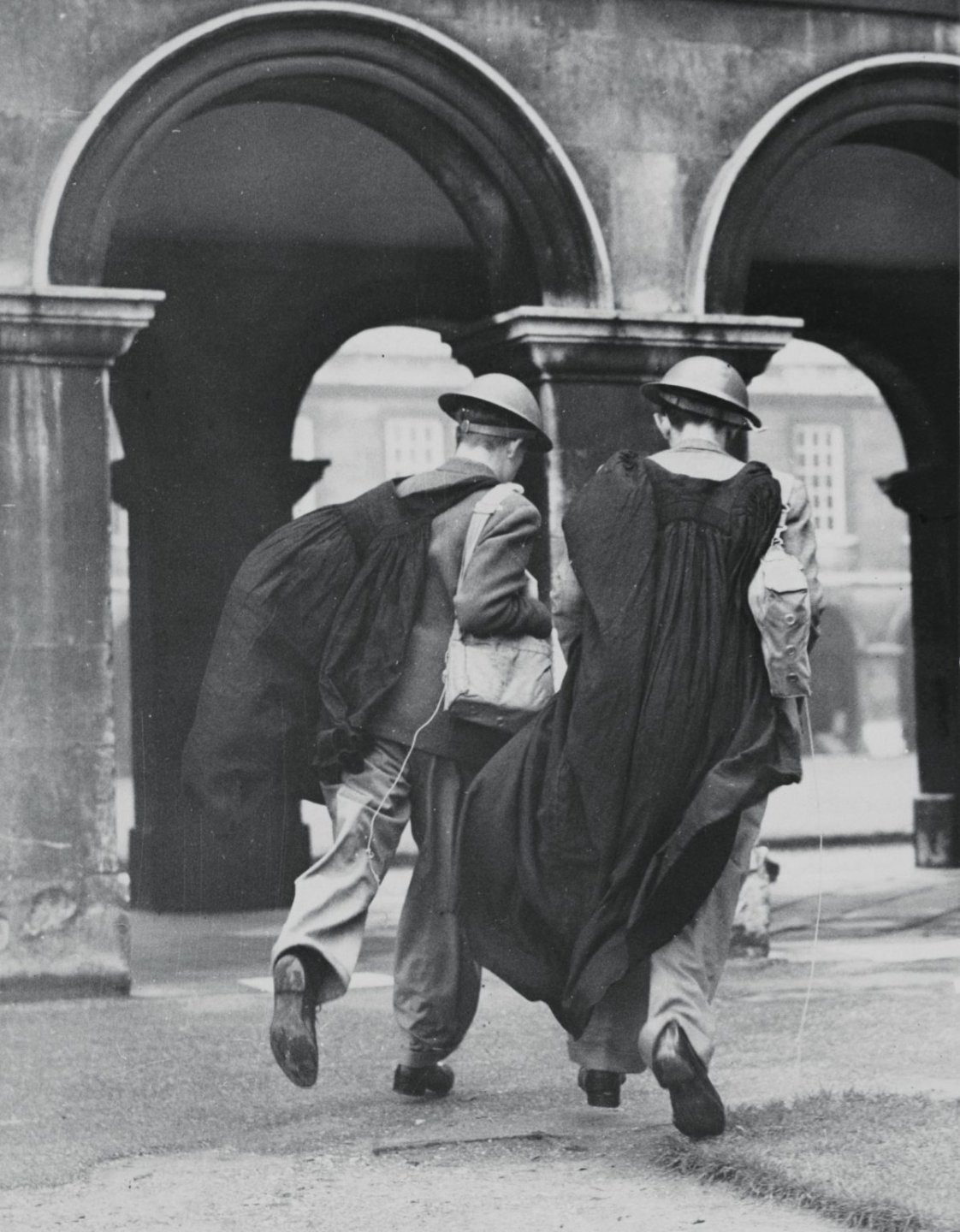 Emmanuel undergrads and a porter from King’s prepare for air raids, 1940.